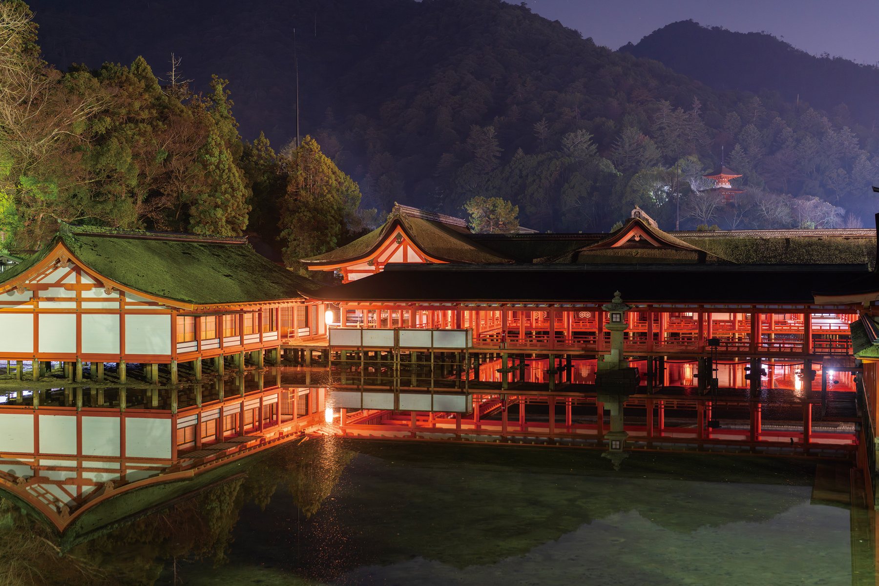 Itsukushima Shrine glowing vermilion at night